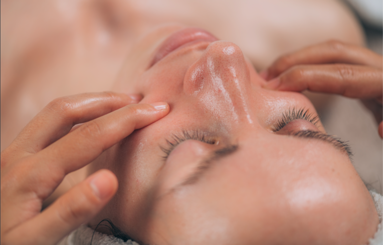 A close-up view of a woman having a facial